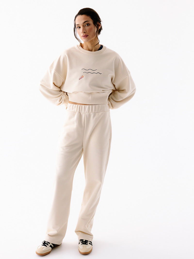 Kremowe bawełniane spodnie dresowe damskie Evolve - widok na ściągacz w pasie