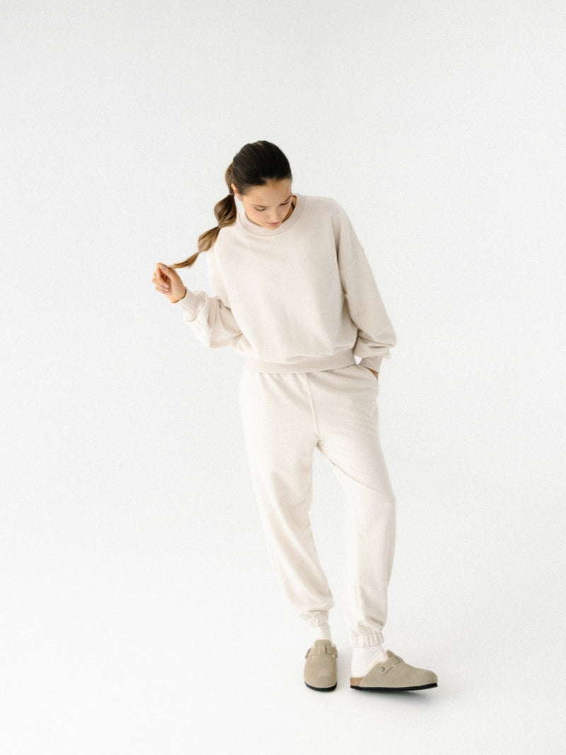 Kremowe, luźne bawełniane spodnie dresowe damskie marki JOYINME