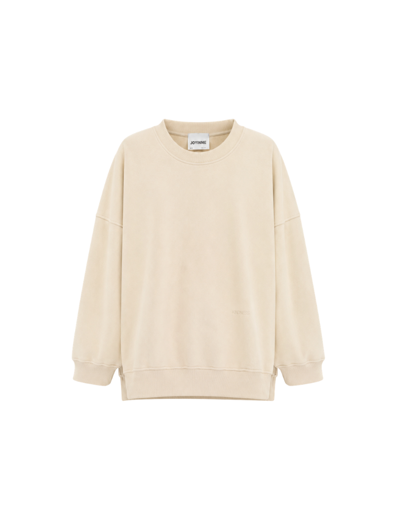Masełkowa, bawełniana bluza oversize Kind o wydłużonym kroju. Obniżona linia ramion, miękka dzianina i detal KINDNESS, na co dzień i po jodze!